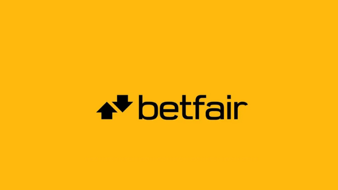 Betfairs logotyp med svart text och två pilar på gul bakgrund.
