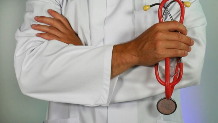 health-check-gambling-addiction medical professional holding stethoscope