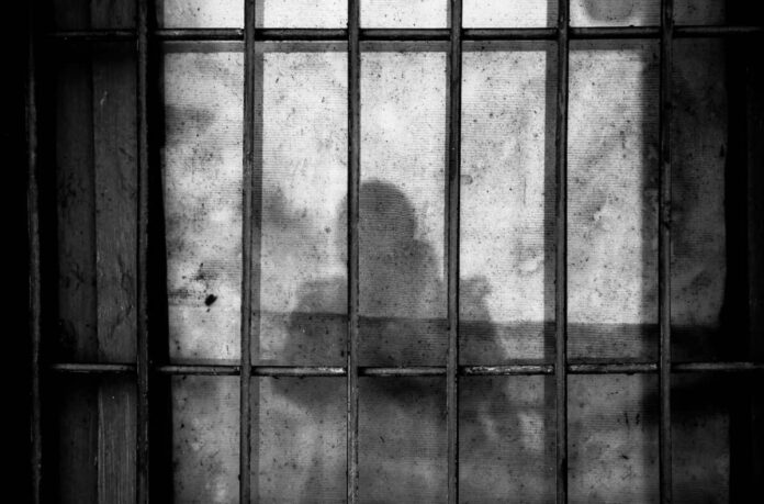 Ohtani-Advisor-Jailed Prison behind shadows