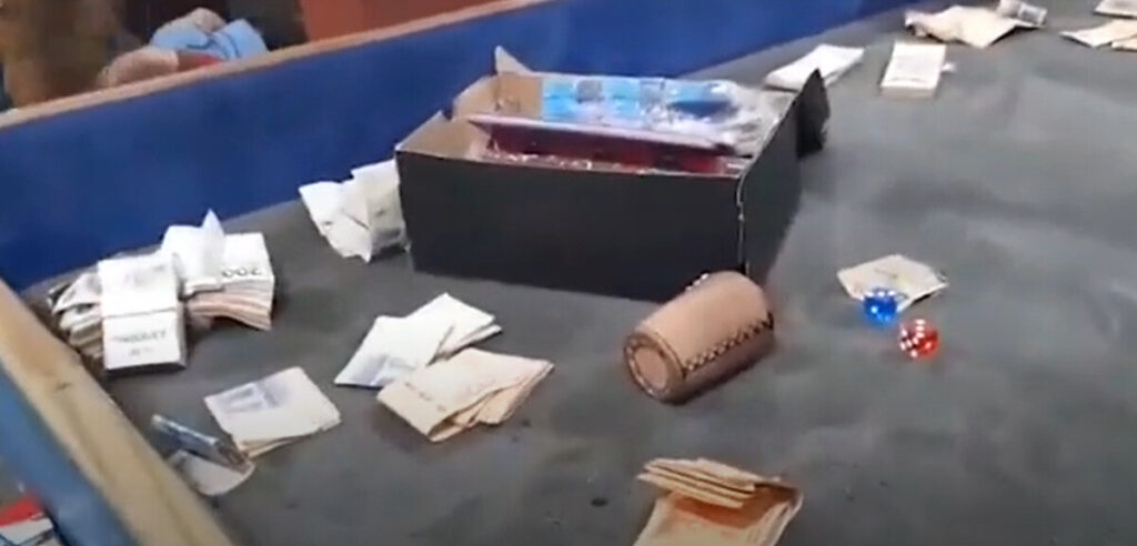 Dice and cash seized by the Buenos Aires Metropolitan Police in a raid on a suspected gambling den.