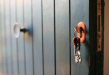 Keys unlocking a door