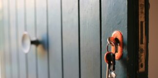 Keys unlocking a door