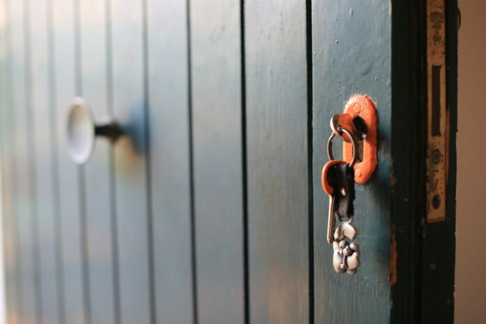 Keys unlocking a door