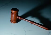 a gavel hitting a marble surface