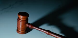 a gavel hitting a marble surface
