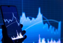 stock charts showing on a mobile phone and screen