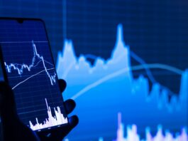 stock charts showing on a mobile phone and screen