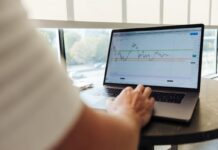 Laptop screen showing graph of stocks/financial market