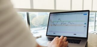 Laptop screen showing graph of stocks/financial market