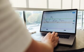 Laptop screen showing graph of stocks/financial market