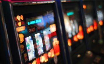 a row of slot machines inside a casino