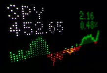 a stock chart listing on a digital board