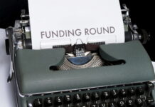 Typewriter with a Funding Round Paper