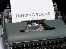 Typewriter with a Funding Round Paper