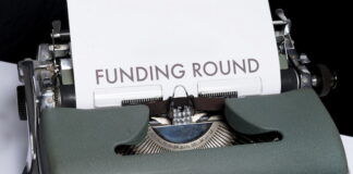 Typewriter with a Funding Round Paper