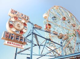 Iconic Wonder Wheel entrance and Ferris wheel at Coney Island on a clear day