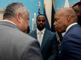 Mayor Eric Adams speaks with Secretary of the Navy Carlos Del Toro at the USS Hamilton announcement.
