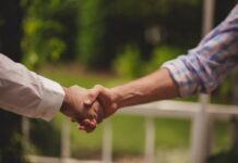 Handshaking in agreement of a deal.