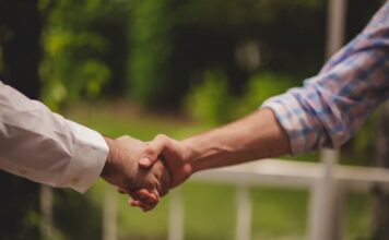 Handshaking in agreement of a deal.