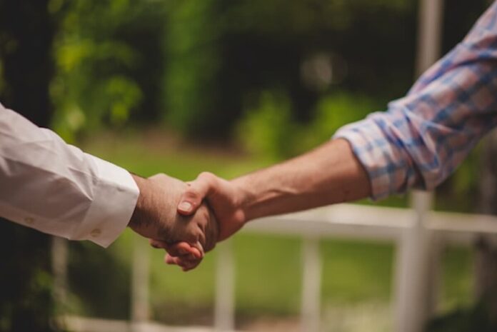 Handshaking in agreement of a deal.