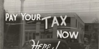 Window with pay your tax here written on it.
