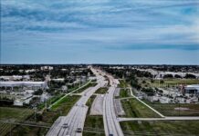 Aerial view of a Cape Coral highway surrounded by businesses and neighborhoods in Florida.