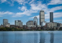 Boston skyline with Prudential Tower, symbolizing regulatory oversight in DraftKings’ $450K fine case.