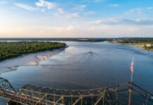 Aerial view of the Mississippi River with a bridge in the foreground.