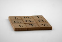 Wooden Scrabble tiles spelling the word “Integrity”