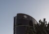 The Star Entertainment building in Australia, with logo visible on curved glass facade under a clear sky.